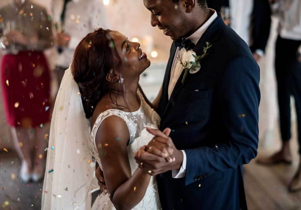 Newlywed African Descent Couple Dancing Wedding Celebration