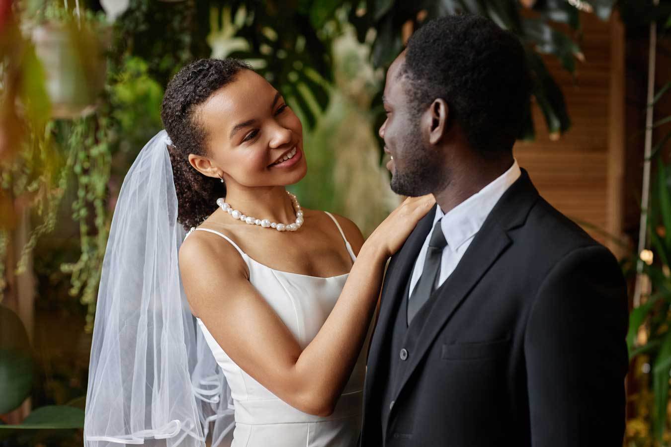 Young black couple getting married and looking at each other with love